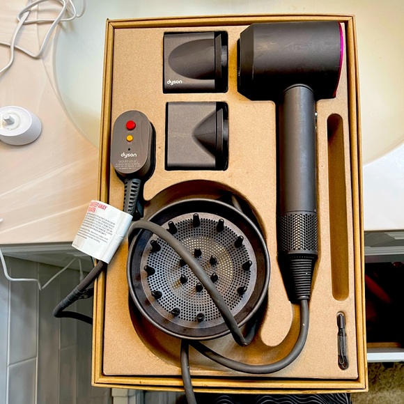 The dyson hair dryer. Used condition but only used about 5...